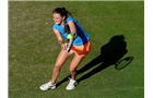 BIRMINGHAM, ENGLAND - JUNE 09:  Katy Dunne of Great Britain returns a shot from Camila Giorgi of Italy on day one of the AEGON Classic Tennis Tournament at Edgbaston Priory Club on June 9, 2014 in Birmingham, England.  (Photo by Tom Dulat/Getty Images)